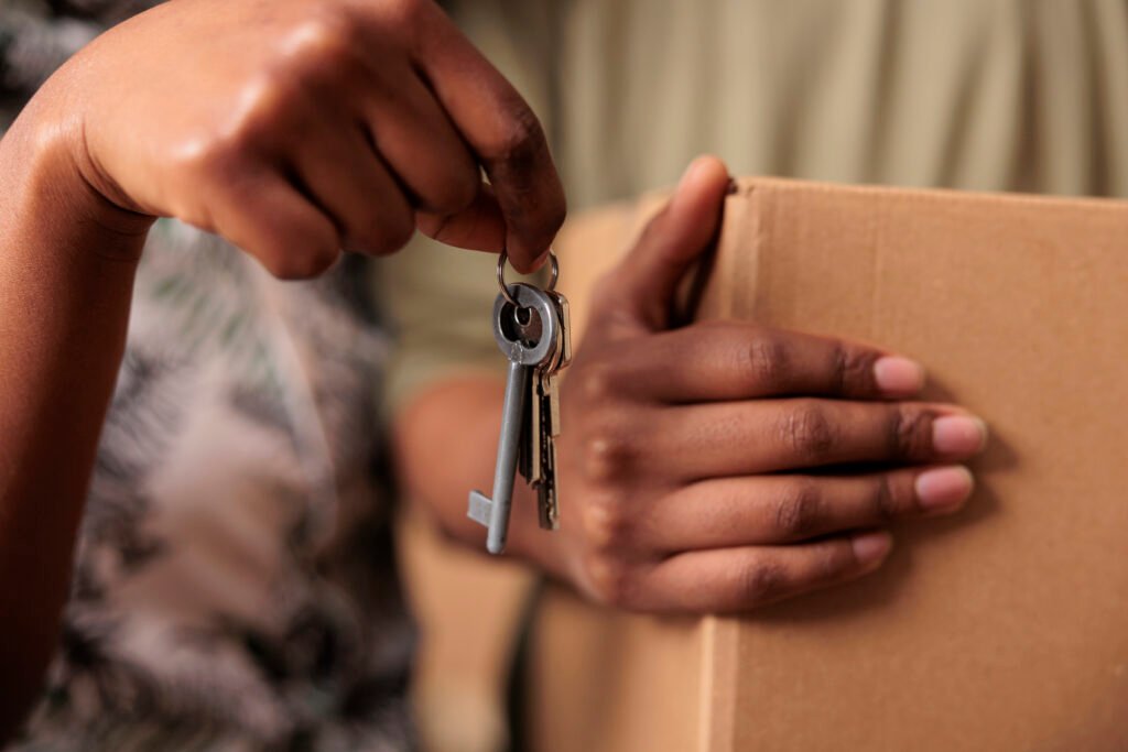 A hand holding house keys