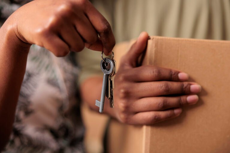 A hand holding house keys